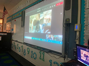 A classroom view of a remote learning session from the decks of Intrepid.