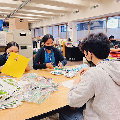 High School interns participating in crafts programs.