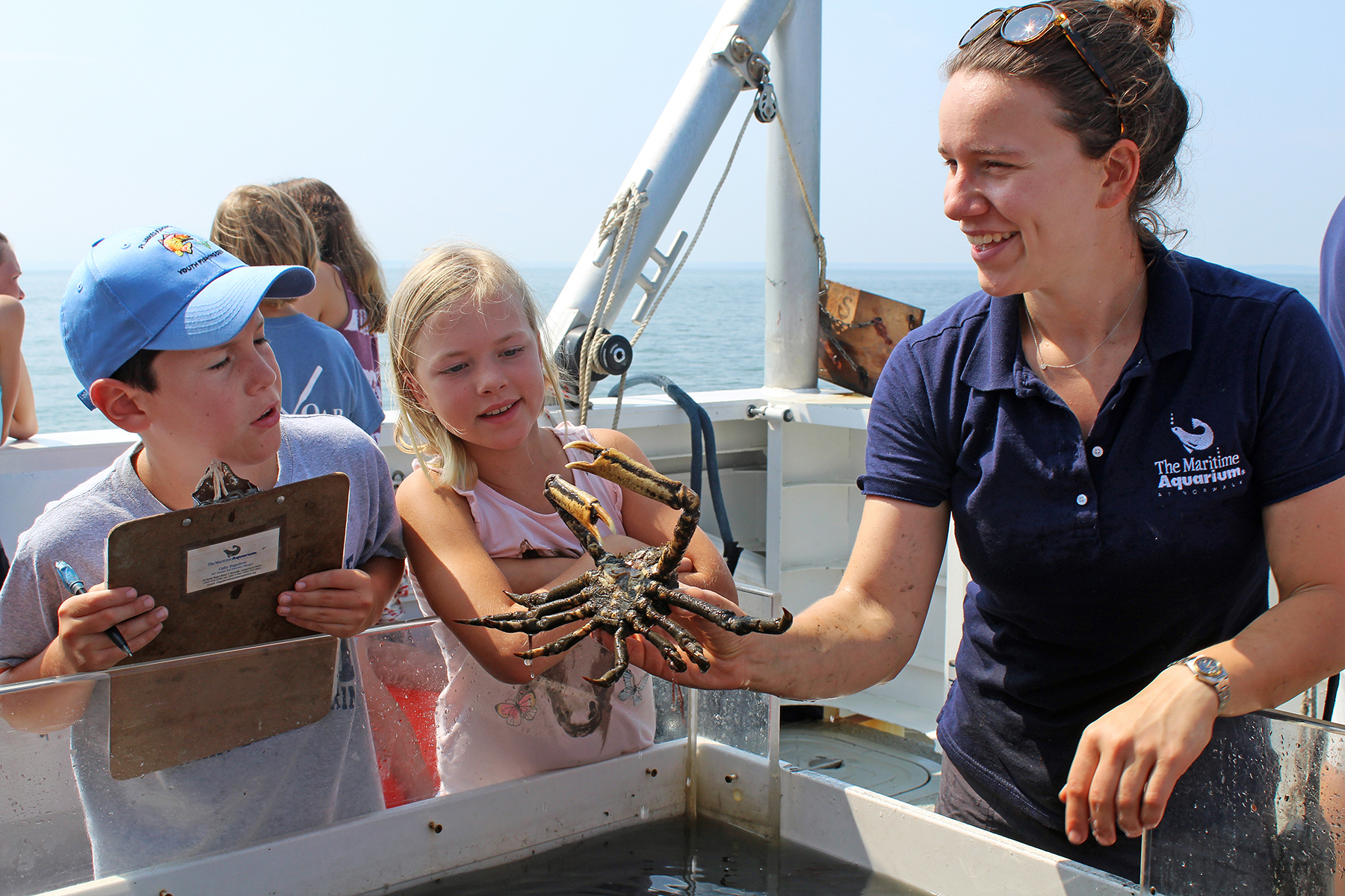 kids and guide with Spider crab the Maritime Aquarium in Norwalk CT