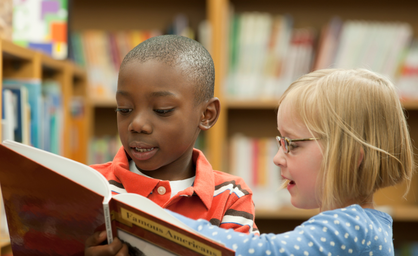 Children reading at the library