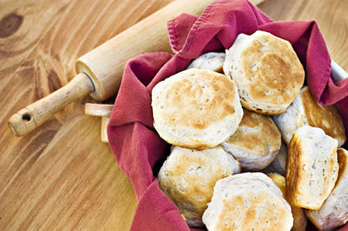 Biscuits in a bowl with rolling pin