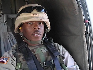 Private Michael Davis Jr. in a Blackhawk helicopter.