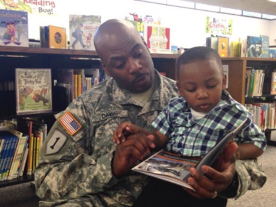 Staff Sgt. Michael Davis Jr. reads to his son.