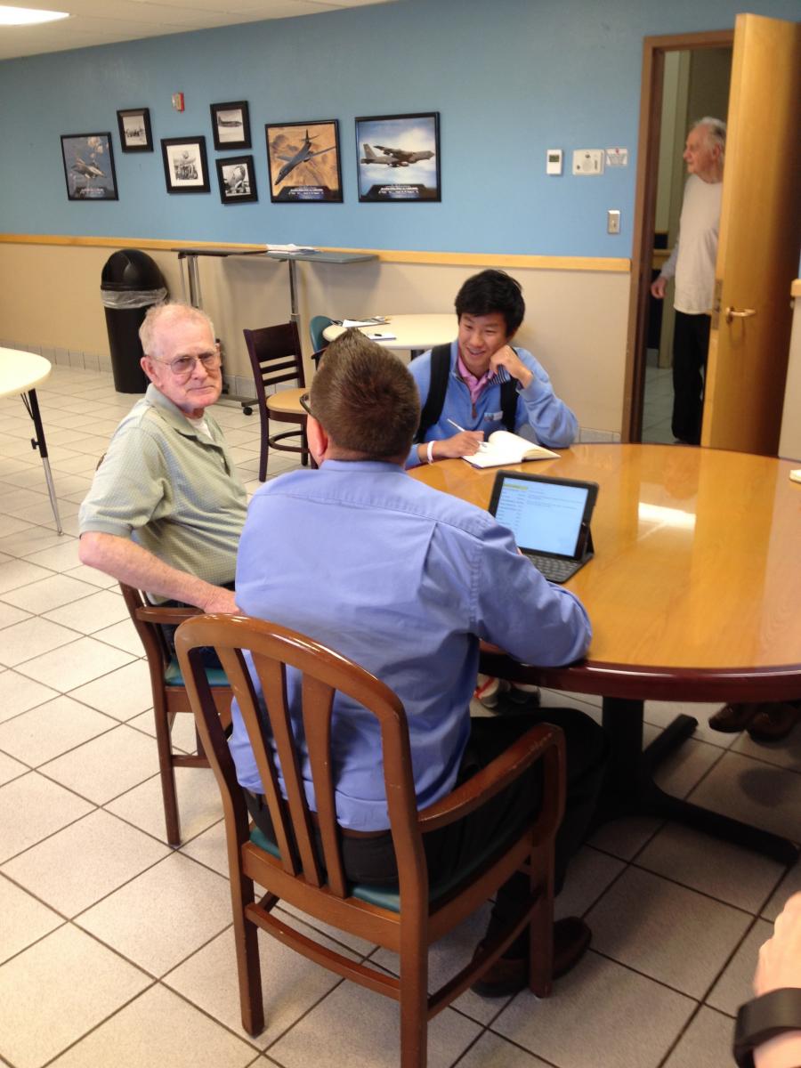 (Photo Courtesy of National Student Poets Program: NSPP’s David Xiang and Jason Poudrier interviewing one of the veterans with dementia, recording his story for the family and posterity.)	