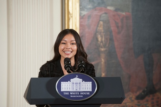 Tribal Youth Amassador speaks at podium during award ceremony