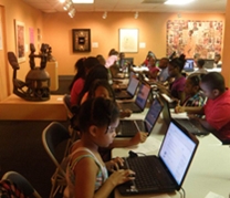 students use computers in the museum