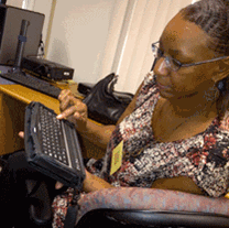 ALFA Fellows learn about digital Braille readers for people with visual disabilities.
