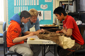 High school students working on a portion of the parka