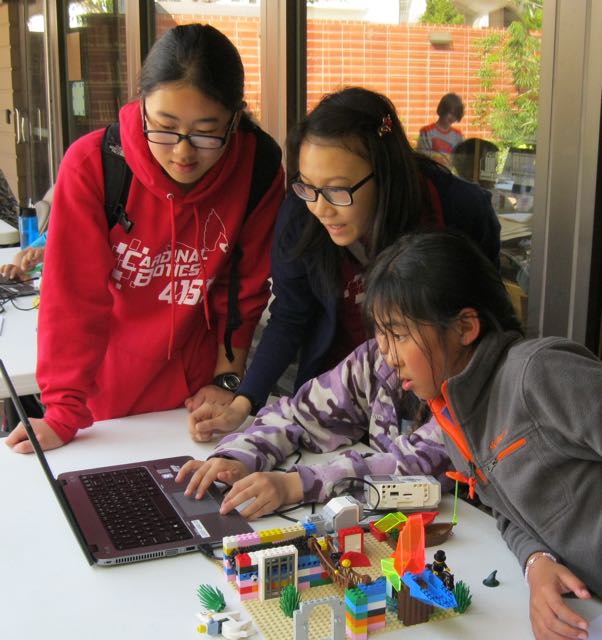 Older students participate in a Lego Mindstorm challenge at the San Francisco Public Library. 
