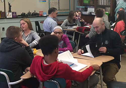 Eastlake Middle School students and police officers work together to combine their written poetry