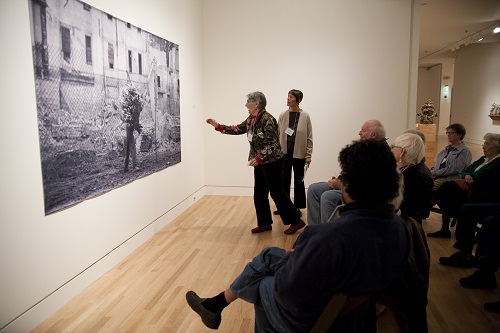 Individuals participating in gallery discussion