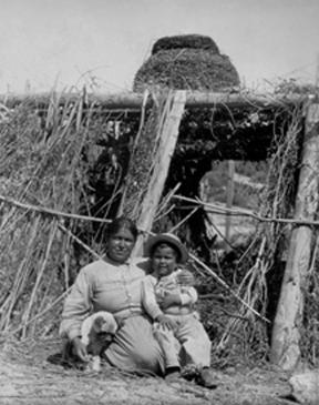 Caption: Carolina Leto and son sitting under granary basket, San Ignacio, San Diego County, April 9, 1904. Photo was digitized and made web-accessible through a 2010 IMLS grant. Image courtesy of San Diego History Center.