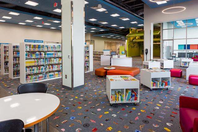 Library interior with bookshelves and reading tables