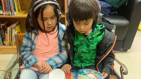 Students at the listening center in the children's library, Nooksack Tribal Library.