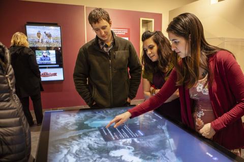 Visitors use the interactive map at the Sealaska Heritage Institute’s exhibit “Our Grandparents’ Names on the Land”. (Photo courtesy of Sealaska Heritage Institute)