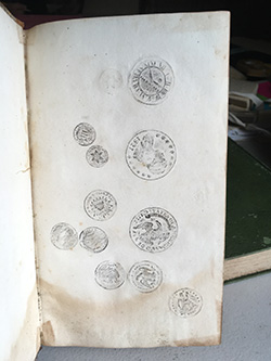 The rubbings of the coins was found in a book of Greek Grammar